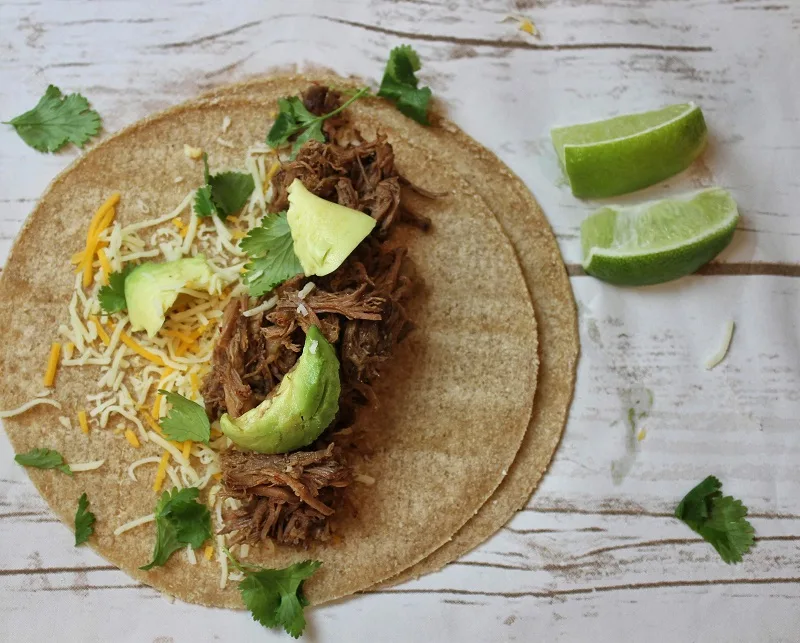 Our delicious beef barbacoa crock pot recipe is full of flavor and perfect for tacos, fajitas, beef bowls, burritos and more making delicious family dinners that everyone will love. Spicy Beef Barbacoa Recipe | Barbacoa Seasoning | How to Make Barbacoa with a Slow Cooker | Slow Cooker Mexican Recipe | Mexican Crockpot Recipes