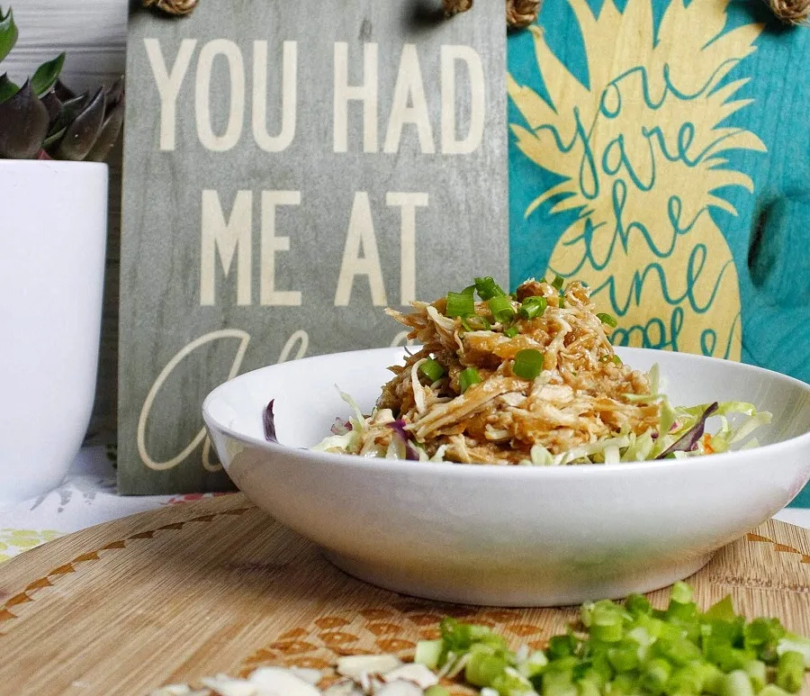 How to Make Crockpot Hawaiian Chicken in a White Bowl with a Sign in the Back That Says You Had Me at Aloha