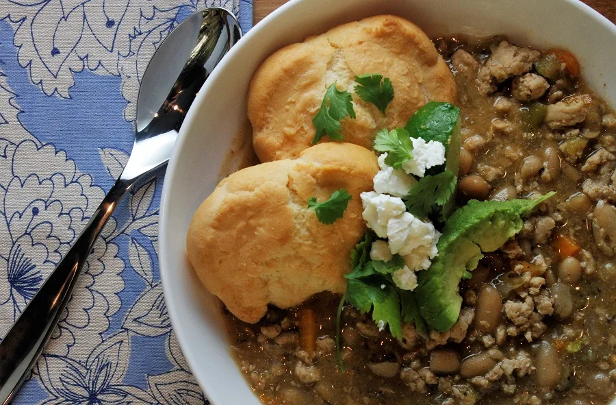 Crockpot Ground Chicken Chili Recipe Close Up of Bowl of Chili with Biscuits and Cilantro