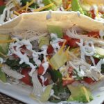 Crockpot Chicken Tacos Drizzeled with Sour Cream
