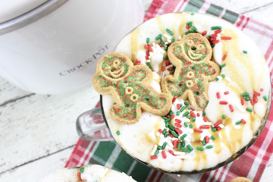 Festive Christmas Latte Recipe Two Gingerbread Cookies on Whipped Cream Garnishing a Cup of Coffee