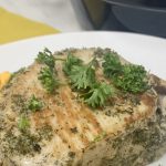 Low Carb Instant Pot Pork Chops Recipe Pork Chops on a Plate in Front of an Instant Pot
