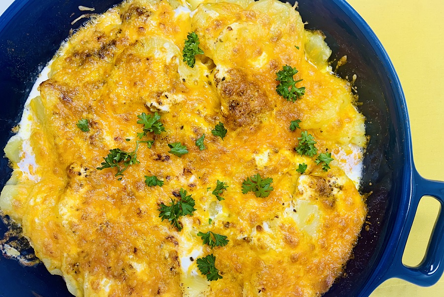 Instant Pot Sour Cream Scalloped Potatoes Close Up of Potatoes in Casserole Dish