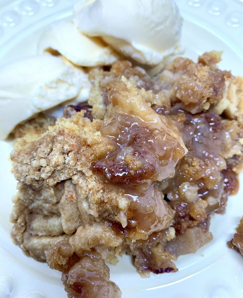 Crockpot Apple Crisp Close Up of Apple Crisp with Ice Cream on a Plate