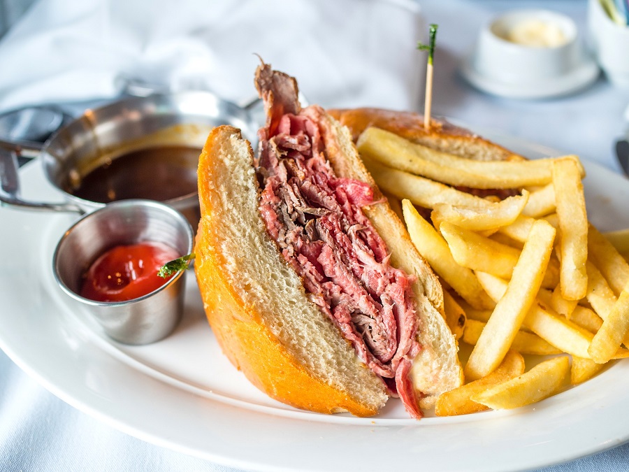 Crockpot Beef Sandwich Recipes A beef Sandwich on a Plate Cut in Half with Fries and Dipping Sauce