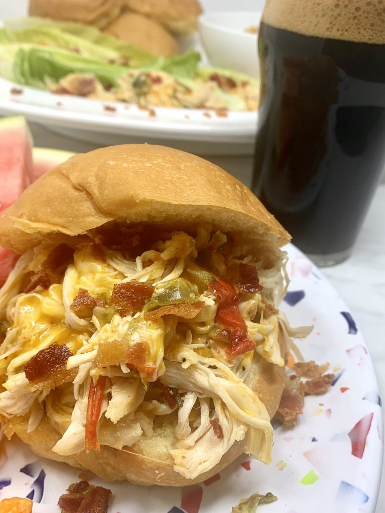 Crockpot Shredded Chicken Sandwiches Someone Holding a Finished Sandwich 
