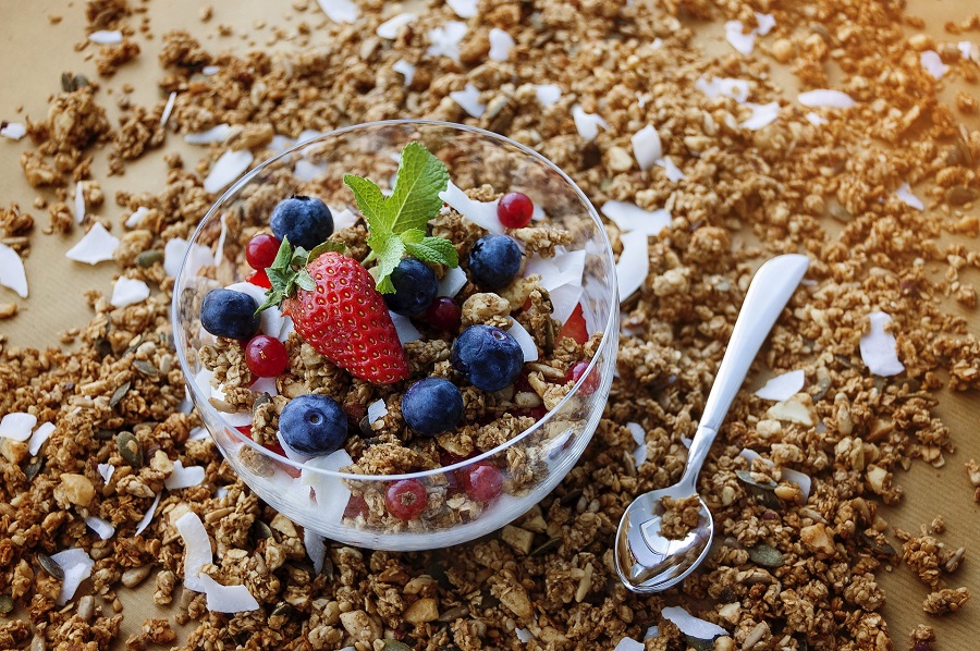 Crock Pot Granola Recipes a Bowl of Granola Sitting on A Table Covered in Granola