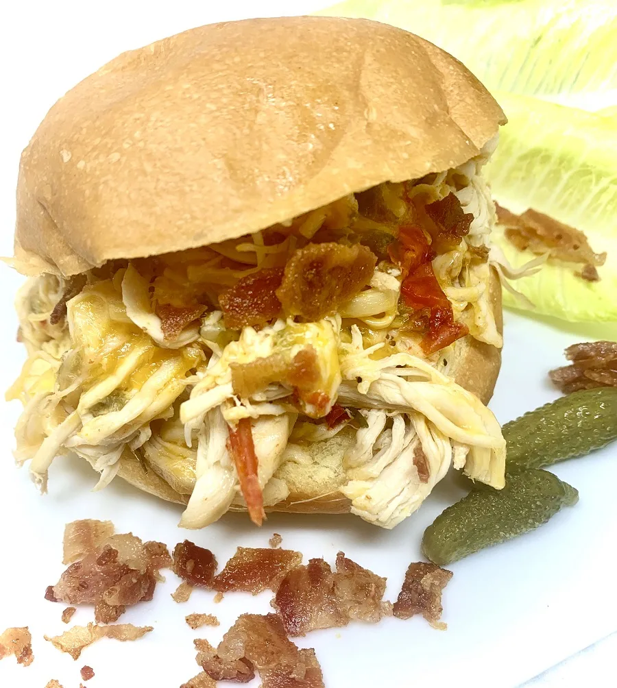 Crockpot Shredded Chicken Sandwiches Finished Sandwich on a Plate with Bacon Crumbles