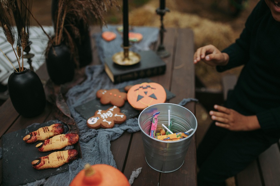 Halloween Pasta Recipes a Wooden Table Outside Covered in Halloween Food