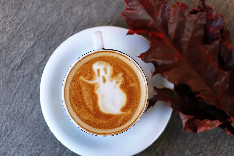Halloween Slow Cooker Cider a Cup of Coffee with a Ghost in the Foam
