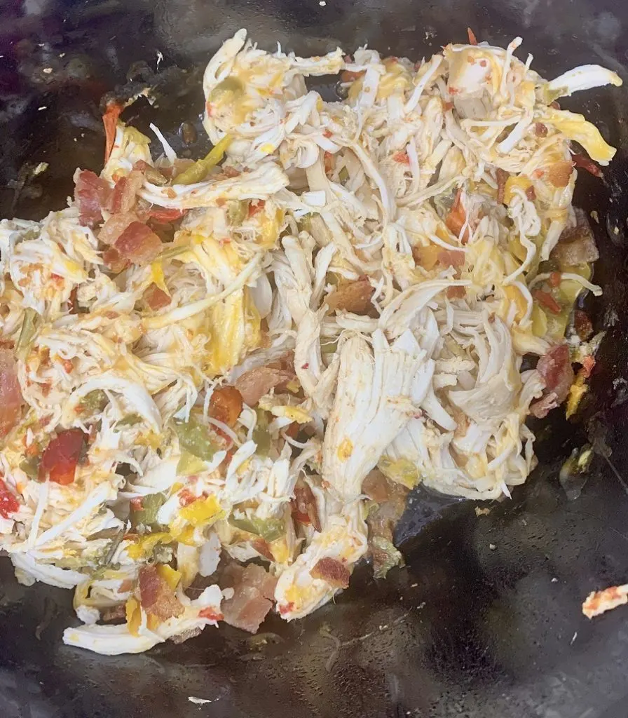 Crockpot Shredded Chicken Sandwiches Chicken Mixed in Crockpot with Other Ingredients
