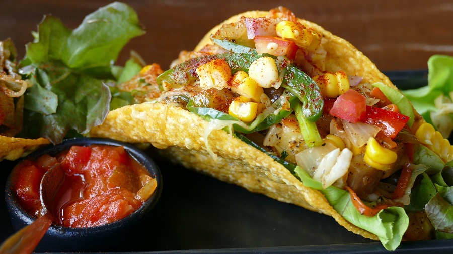 Slow Cooker Chicken Taco Recipes Close Up of a Taco with Salsa Next to it