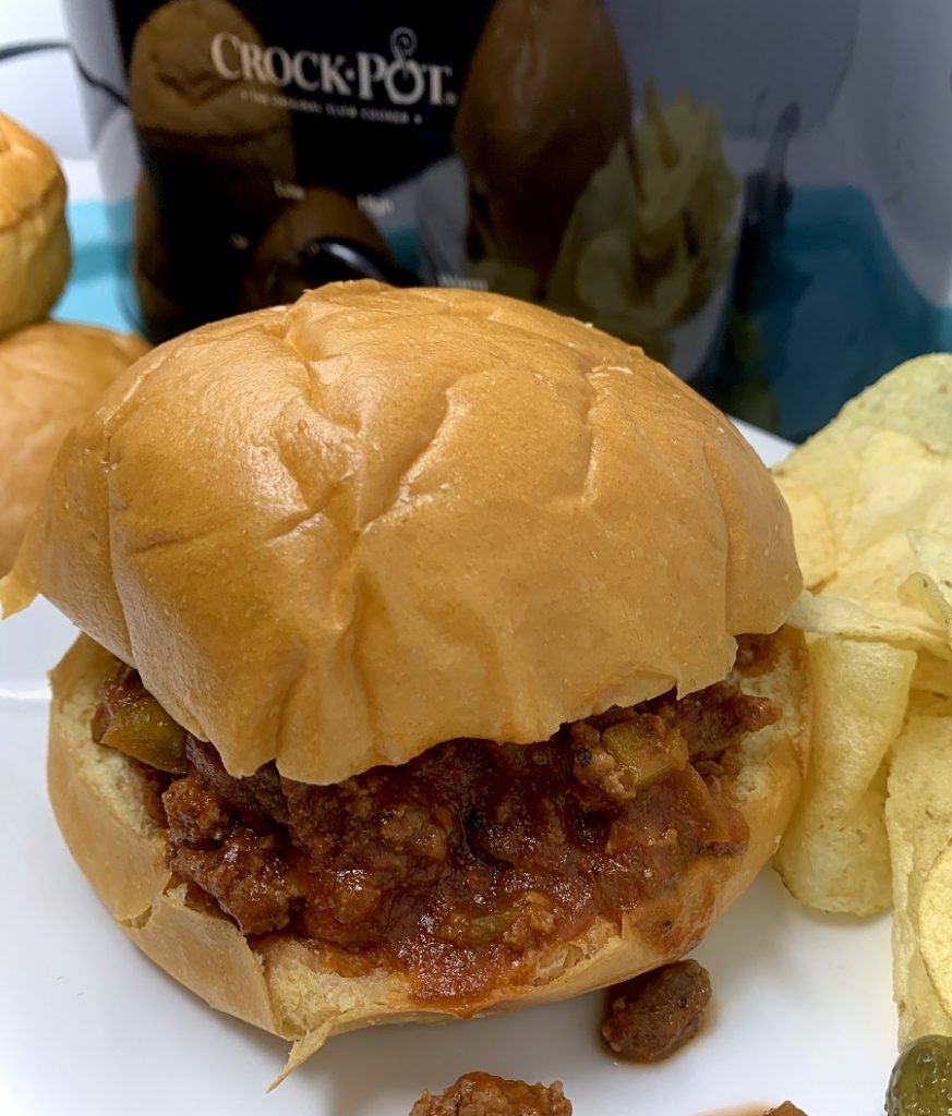 Crockpot Sloppy Joe Recipes Sloppy Joe Sitting on a Plate in Front of a Crockpot