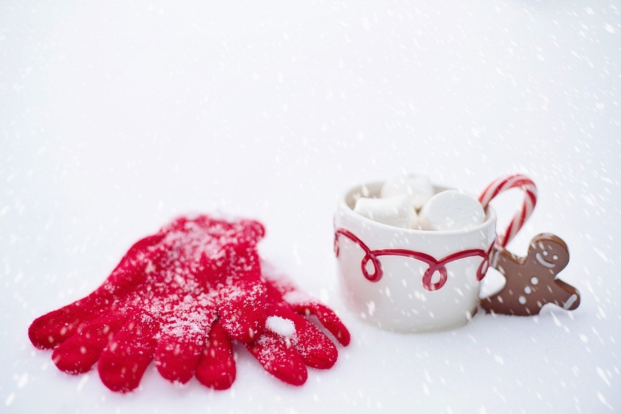 Crockpot Spiked Hot Chocolate Recipes a Cup of Hot Chocolate in the Snow with a Pair of Red Gloves Next to it