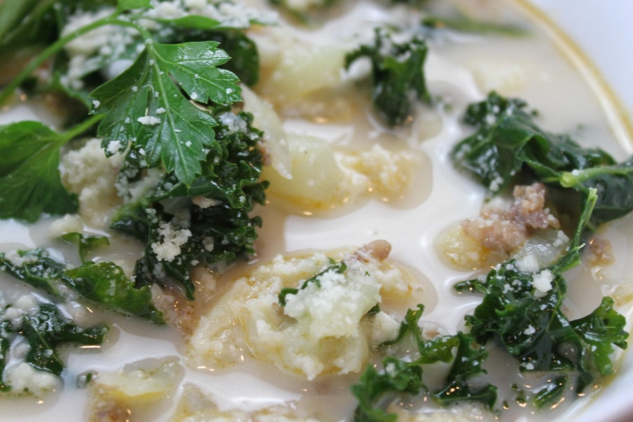 Extreme Close Up of Easy Creamy Kale Soup in a White Bowl