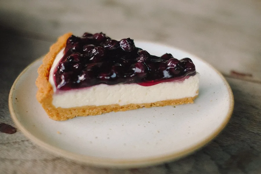 Instant Pot Desserts for a Crowd A Slice of Cheesecake on a Plate