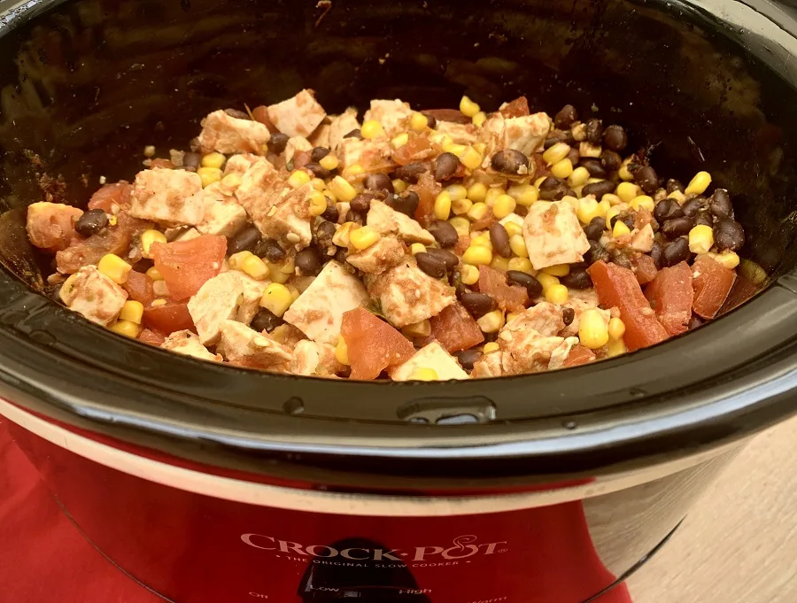 Easy Slow Cooker Salsa Chicken for Tacos Cooking in a Crockpot