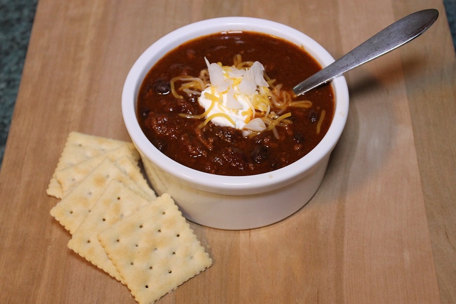 Instant Pot Turkey Chili Recipes Overhead View of a Small Ramekin Filled with Chili Next to Some Crackers