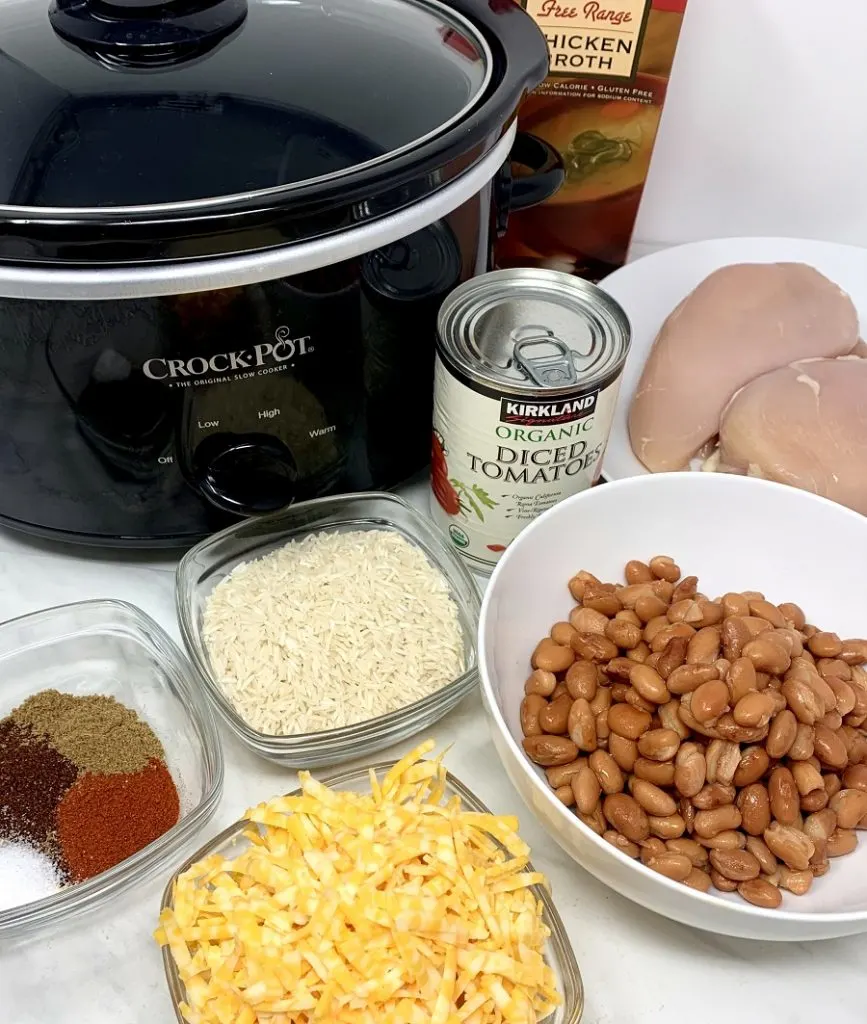 Crockpot Chicken and Rice Burrito Bowl Recipe Ingredients Gathered Together Next to a Crockpot