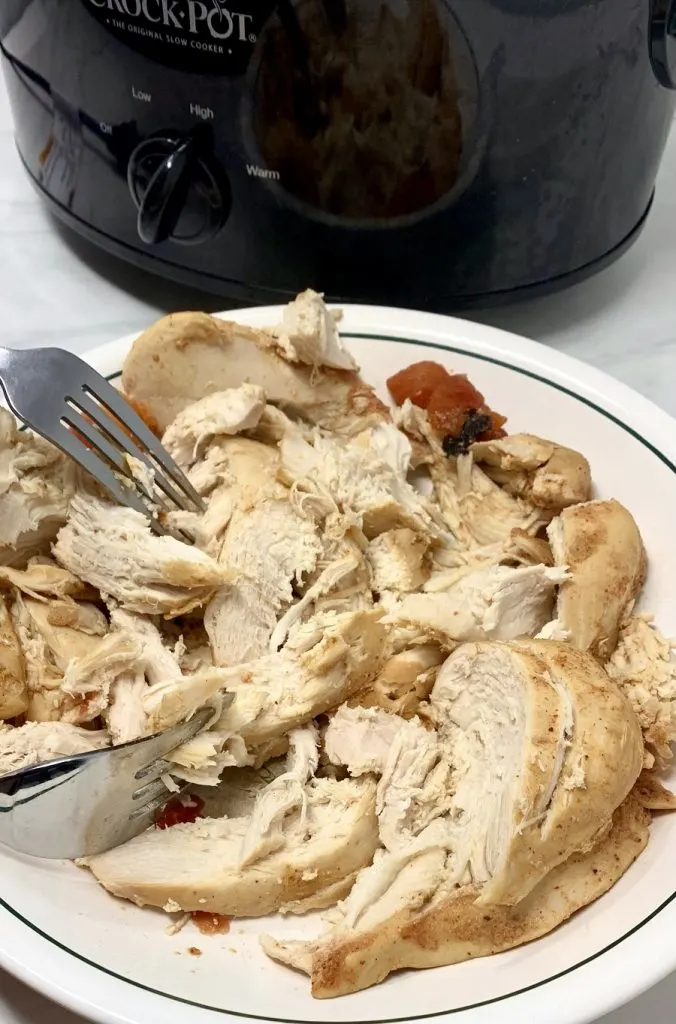 Crockpot Chicken and Rice Burrito Bowl Recipe Chicken Being Shredded on a Plate