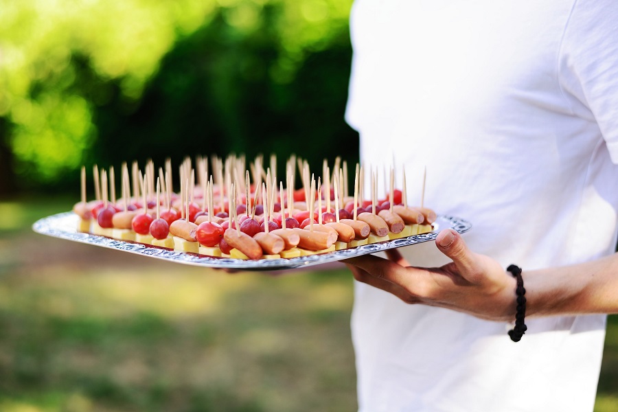 Crockpot Little Smokies with Brown Sugar Recipes Man Holding a Tray of Finger Foods