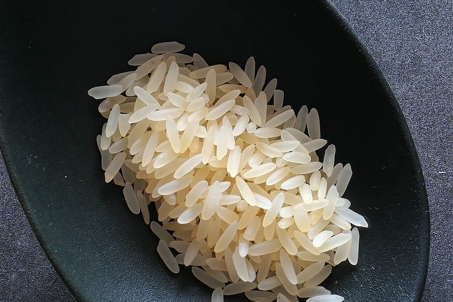 Crockpot Chicken Bowl Recipes Raw Rice in a Small Black Dish