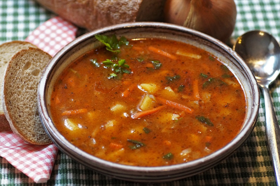 Instant Pot Hamburger Soup Recipes Overhead View of a Bowl of Soup Surrounded with Bread