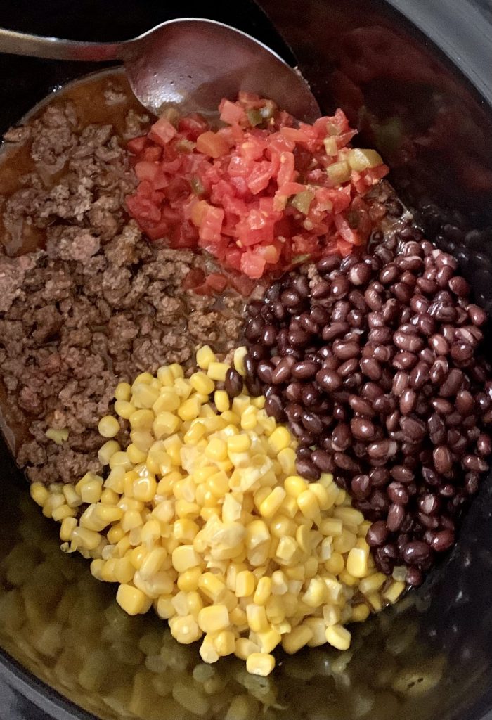 Crockpot Taco Soup Recipe with Beans Overhead View of a Crockpot with Ingredients Inside