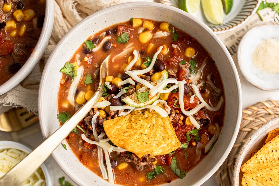 Crockpot Taco Soup Recipe Overhead View of a Bowl of Taco Soup with Tortilla Chips