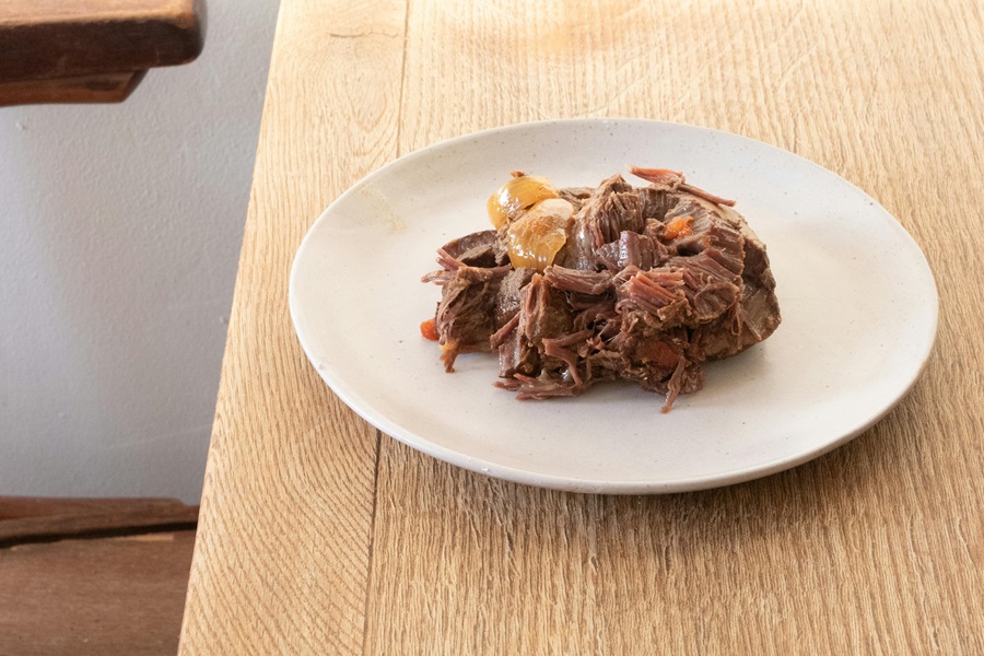 Healthy Crockpot Freezer Meals with Beef a Plate of Beef Roast on a Wooden Table