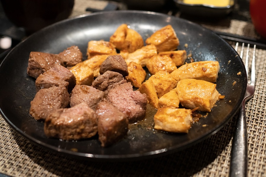 Healthy Crockpot Freezer Meals with Beef Close Up of Beef Tips with Potatoes on a Black Plate
