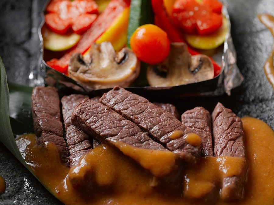 Healthy Crockpot Freezer Meals with Beef Overhead View of Beef Strips with Vegetables in Foil Next to The Beef