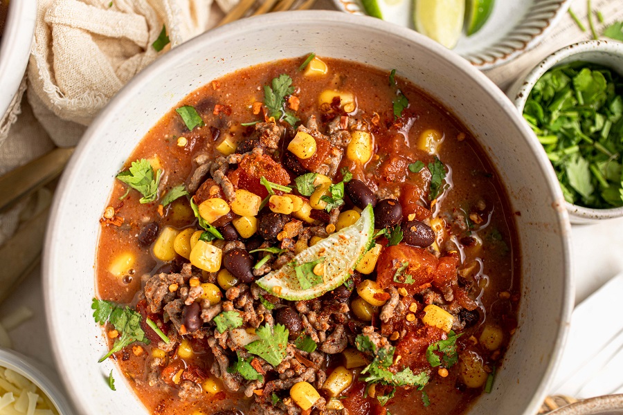 Crockpot Taco Soup Recipe Overhead View of a Bowl of Taco Soup with a Single Lime Wedge