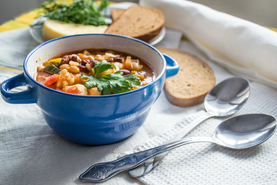 Instant Pot Hamburger Soup Recipes a Small Blue Bowl of Soup with Bread and Two Spoons Next to the Bowl