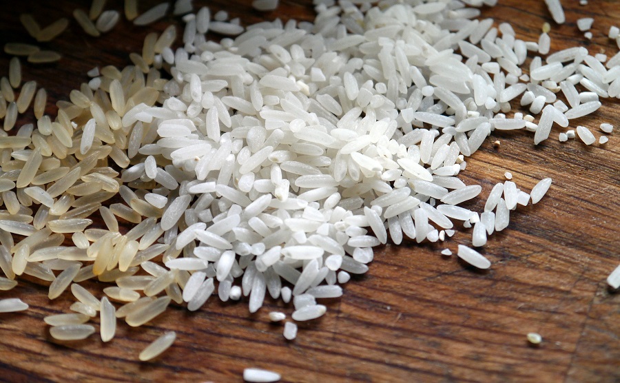 Instant Pot Tips for Cooking Rice Raw Rice Pouring Out of a Bag