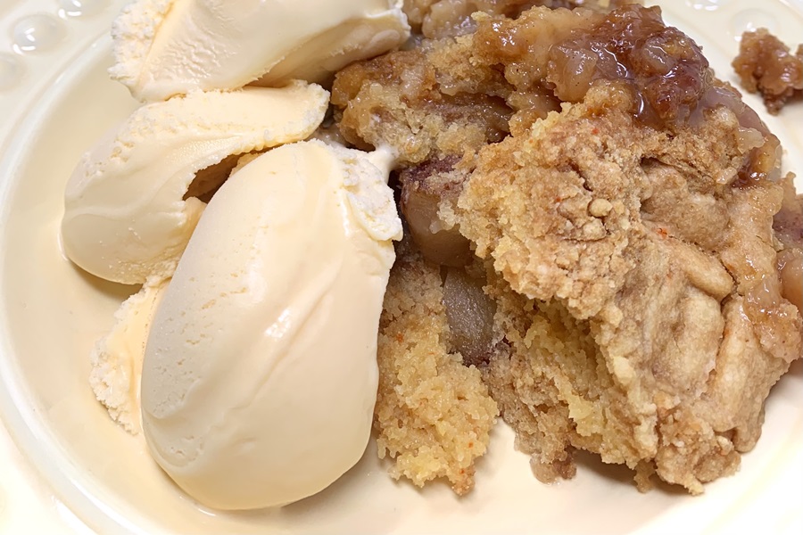 Crockpot Apple Crisp with Cake Mix Recipe Close Up of a Plate of Apple Crisp with Two Scoops of Vanilla Ice Cream