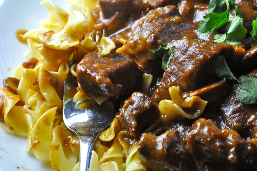 Slow Cooker Beef Stroganoff with French Onion Soup Close Up of Beef Stroganoff with a Fork