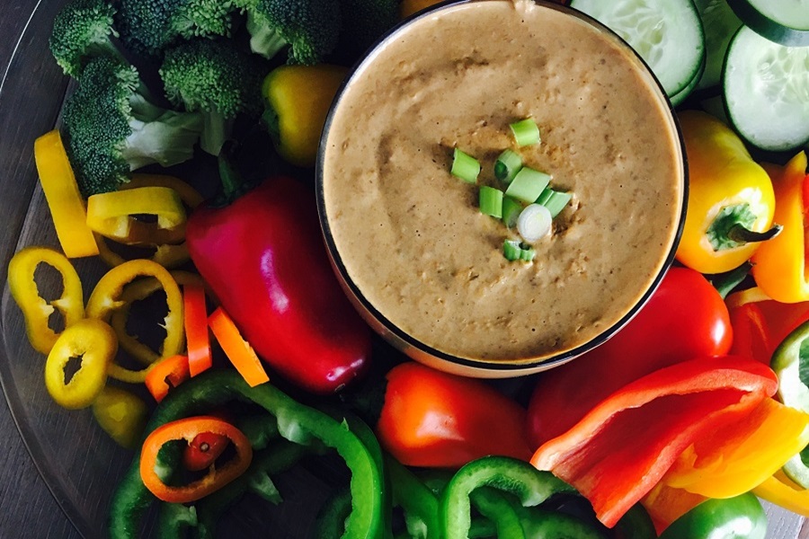 Crockpot Cheese Dip with Beans (No Velveeta) a Small Dish of Dip Surrounded with Bell Peppers, Jalapenos, and Cucumber Slices