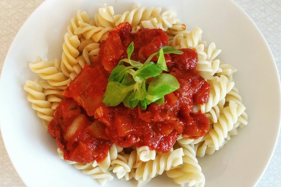 Instant Pot Pasta Recipes Close Up of Spiral Pasta with Tomato Sauce On Top and a Sprig of Basil