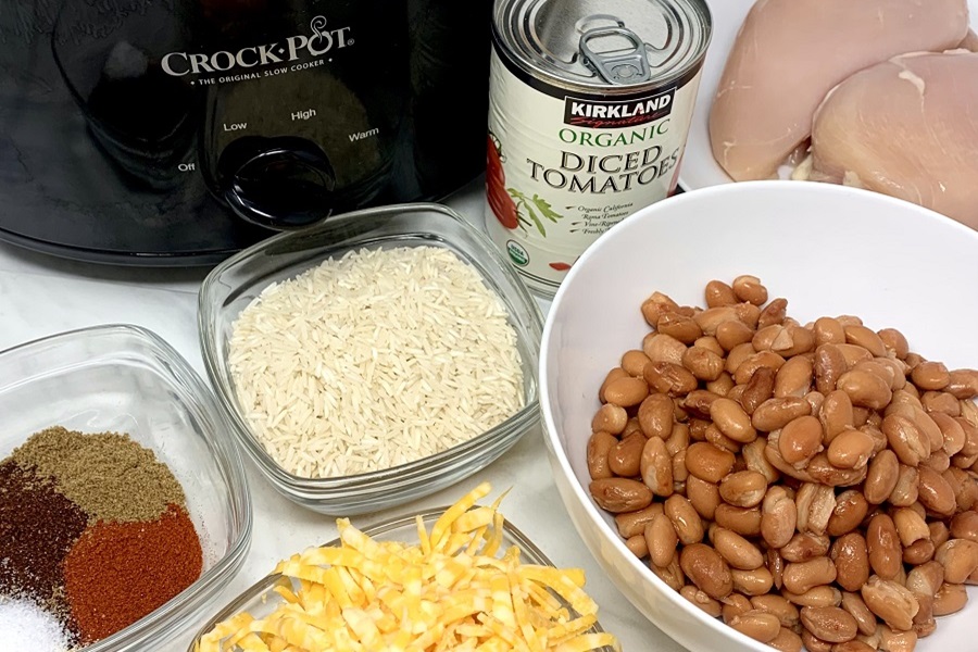 Chicken and Rice Crockpot Recipes Chicken and Rice with Beans and Cheese Ingredients Spread Out in Front of a Crockpot