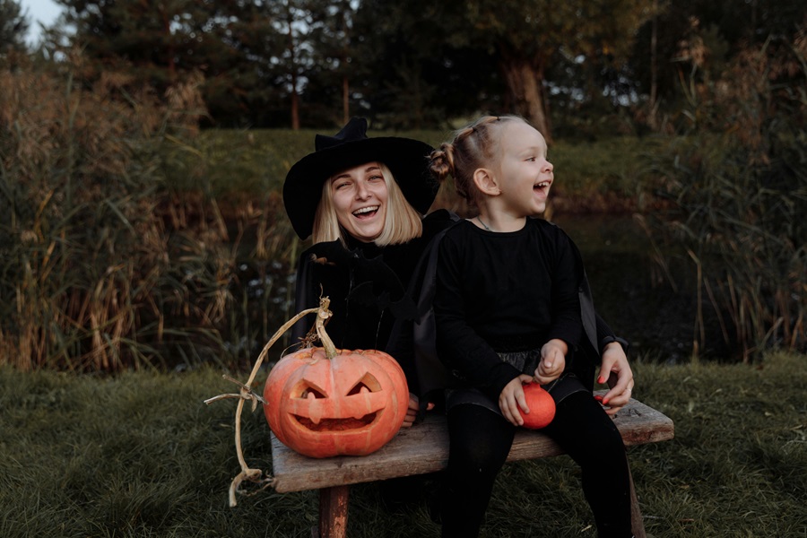 Halloween Deviled Egg Recipes a Mother and Daughter in Halloween Costumes Holding Jack-O-Lanterns