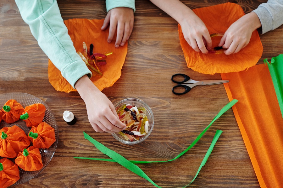 Instant Pot Halloween Recipes Overhead View of People Making Halloween Treat Bags