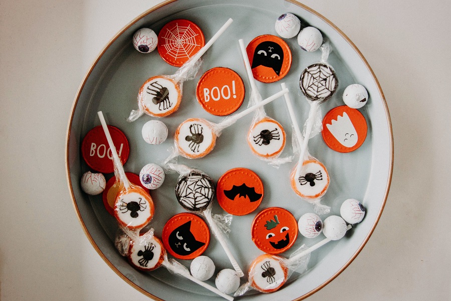 Instant Pot Halloween Recipes Overhead View of a Platter with Halloween Candy Scattered Around on it