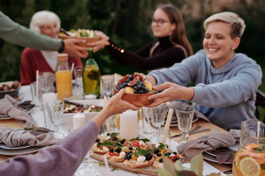 Crockpot Thanksgiving Recipes Family at a Picnic Table Outdoors Having a Meal