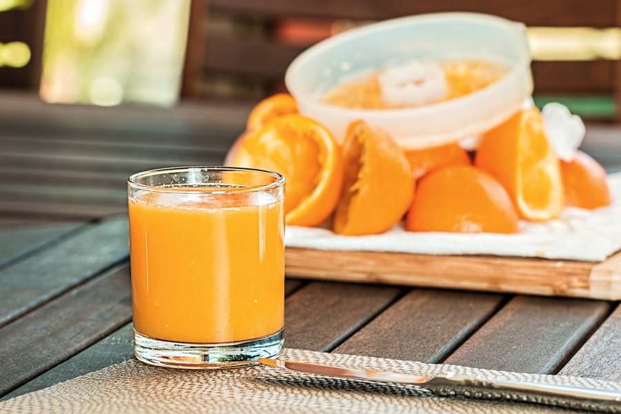 Easy Instant Pot Breakfast Recipes Close Up of a Glass of Orange Juice with Oranges in the Background
