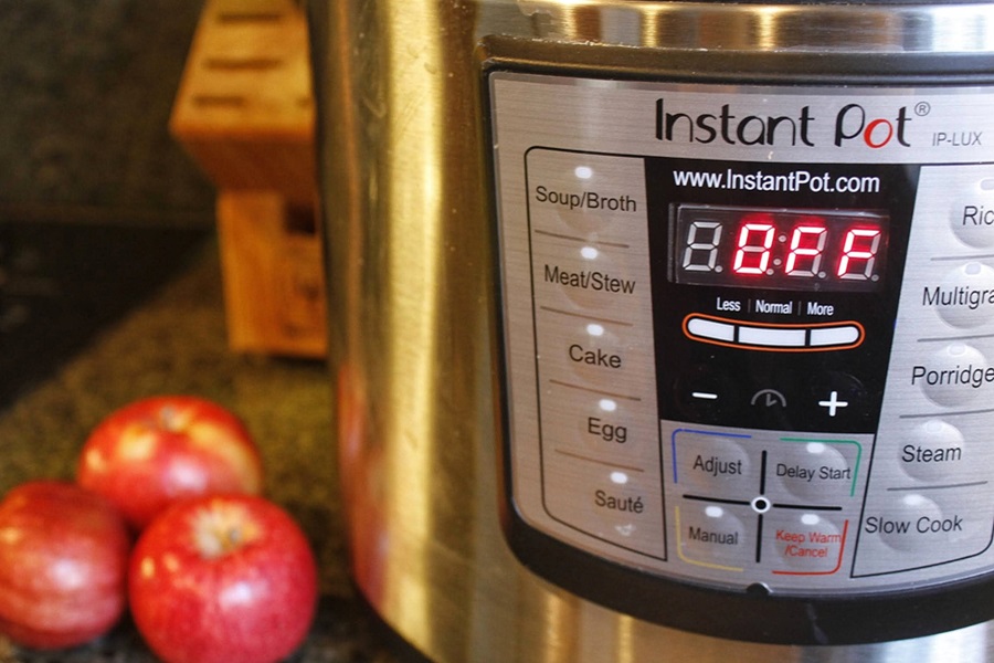 Instant Pot Cooking Tips and Tricks Close Up of an Instant Pot with Apples Next to it