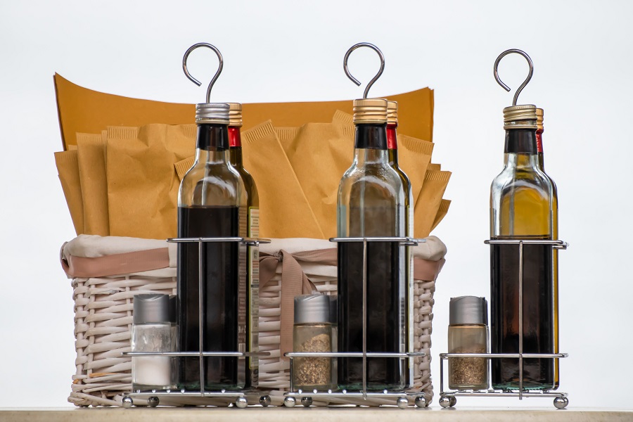 Instant Pot Balsamic Chicken Recipes Close Up of a Rack of Oils and Vinegars in Glass Bottles