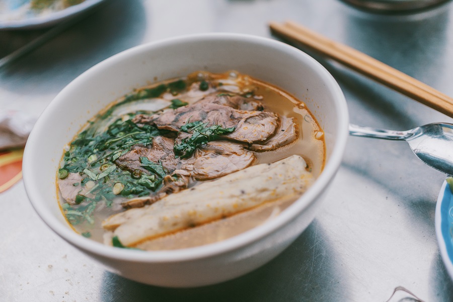 Instant Pot Kale Soup Recipes Overhead of a Bowl of Soup with Meat and Veggies