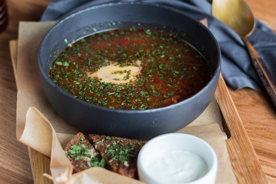 Crockpot Mexican Soup Recipes Angled View of a Bowl of Soup on a Wooden Serving Tray