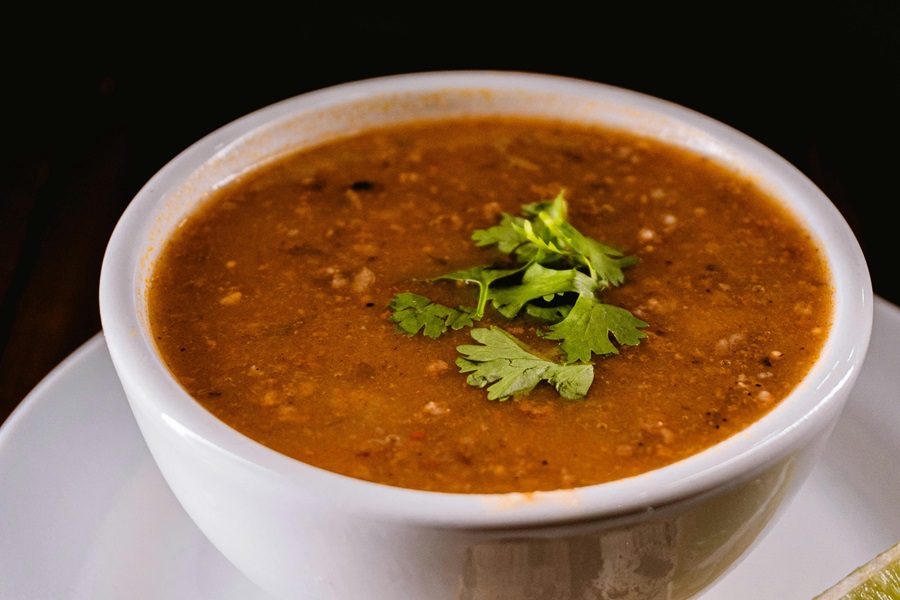 Crockpot Mexican Soup Recipes Close Up of a Bowl of Soup Topped with a Few Cilantro Leaves